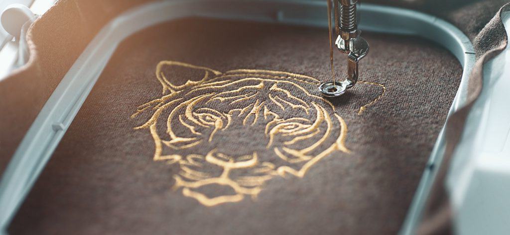 an example of a flat embroidery with a tiger design